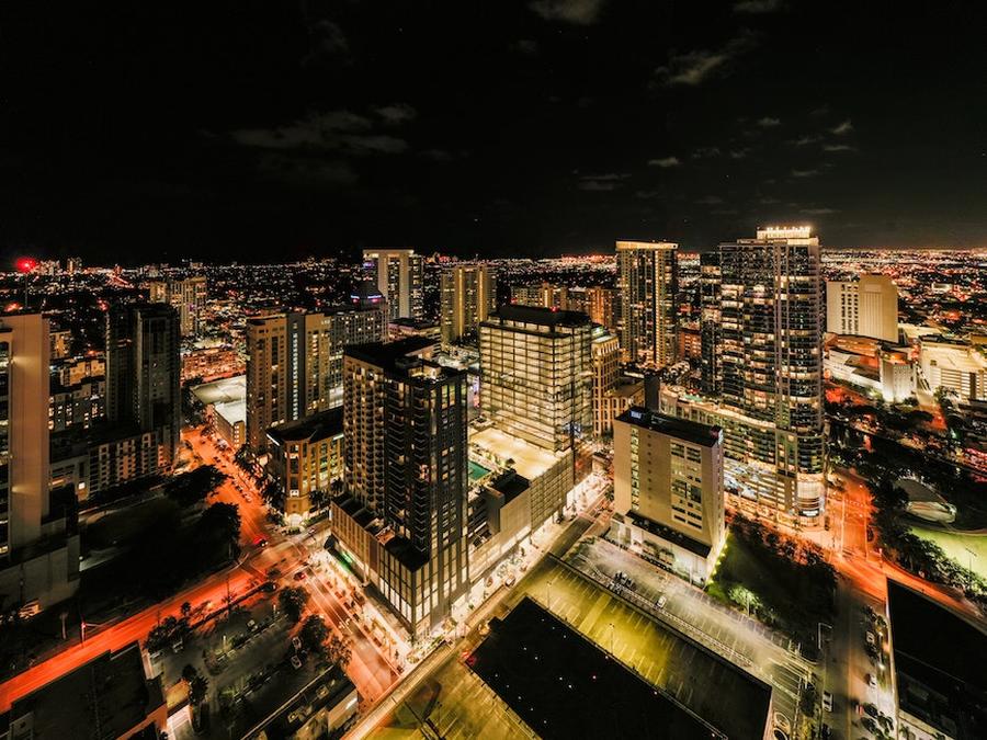 drone view of illuminated glass skyscrapers in financial district of fort lauderdale against night s